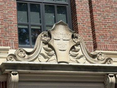 The Harvard Shield above a door