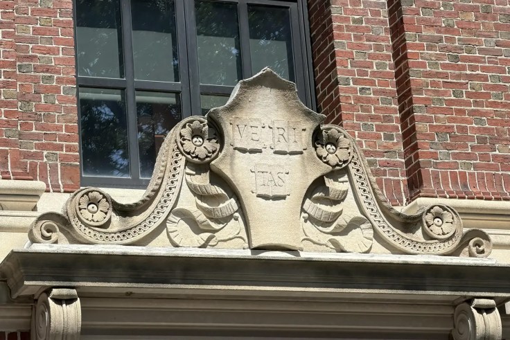 The Harvard Shield above a door