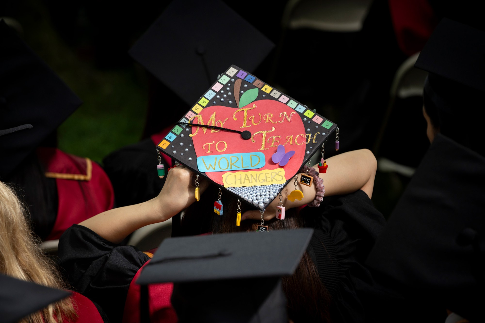 A decorated graduation cap that says