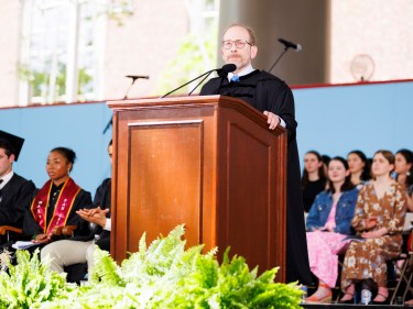 Harvard President Alan Garber at a podium